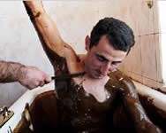 Another man soaking in 100% natural and organic crude oil